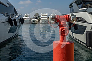 Close-up of a fire hydrant in a luxury marina