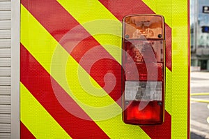 Close-up fire truck, with red lights for safe driving, outdoors.