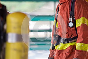 Close up fireman in fire fighting protection suit and equipment