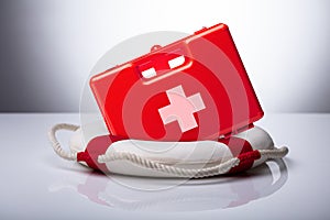 Close-up Of First Aid Kit And Lifebuoy