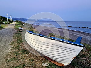 close-up of a fishing boat beached at the sea