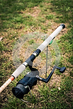 Close-up on a fishing reel mounted on the fishing rod