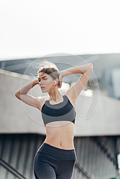 Close up of a fitness woman doing warm up exercises