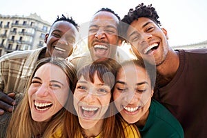 Close up Five cheerful faces of young friends selfie. Happy people looking camera fooling around