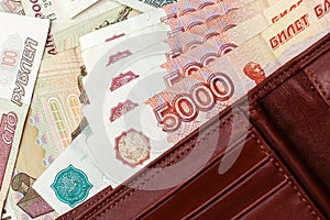 Close-up of five thousand rubles banknotes in the leather wallet