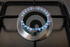 Close-up of a flame of methane gas stove in a domestic kitchen