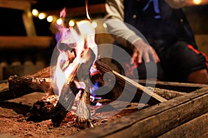 Close-up of flames from bonfire wood burning in night campfire