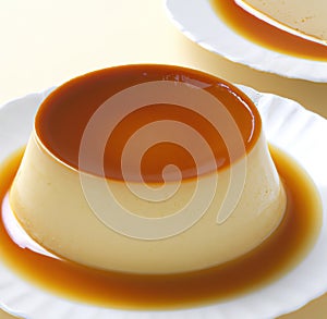 Close up of flan on white plate created using generative ai technology