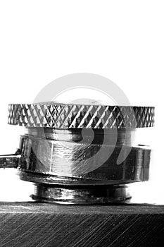 Close-up of a flask with hands on white background