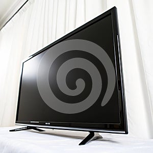 Close-up of a flat-screen TV against a white backdrop isolated on white background
