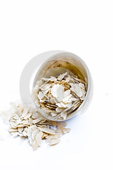 Close up of Flattened rice or beaten rice or Phoa or pava in a bowl isolated on white. photo