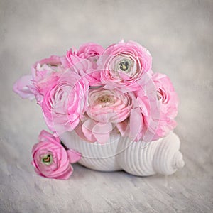 Close-up floral composition with a pink Ranunculus flowers