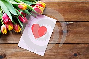 Close up of flowers and greeting card with heart