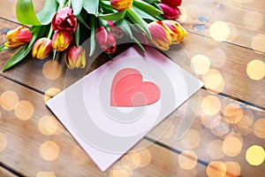 Close up of flowers and greeting card with heart