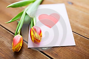 Close up of flowers and greeting card with heart