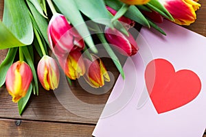 Close up of flowers and greeting card with heart