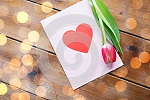 Close up of flowers and greeting card with heart