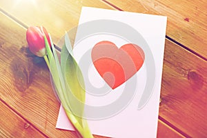 Close up of flowers and greeting card with heart