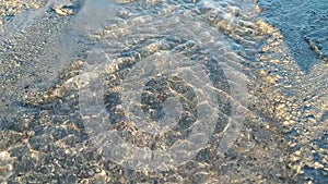 Close Up of Flowing Pristine and Clear Water on the Beach During Low Tide