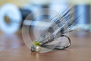 Close up fly fishing fly. Handmade trout fishing fly