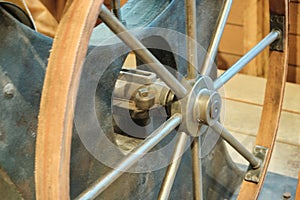 A close-up of the flywheel of an industrial steam engine.