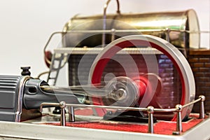 Close up of the flywheel of a steam engine