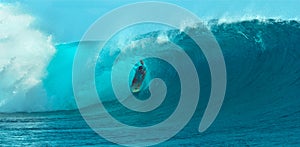 CLOSE UP: Foaming ocean water splashes behind fearless pro surfer riding a wave.