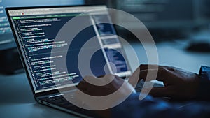 Close-up Focus on Person's Hands Typing on the Desktop Computer Keyboard. Screens Show Coding