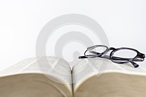 Close-up of a folded reading glasses