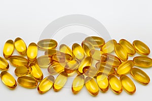 Close up of food supplement oil filled capsules suitable for: omega 3, omega 6, vitamin A, vitamin D, vitamin E