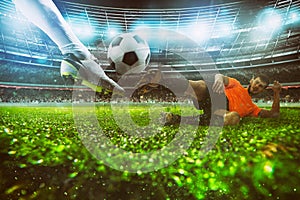 Close up of a football action scene with competing soccer players at the stadium during a night match