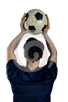 Close up of a football action scene with soccer player throws a soccerball