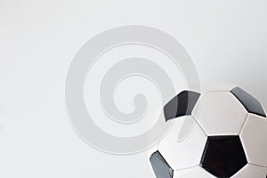 Close up of football or soccer ball over white