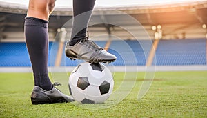 Close Up Football or Soccer Player Foot Playing With the Ball in Stadium