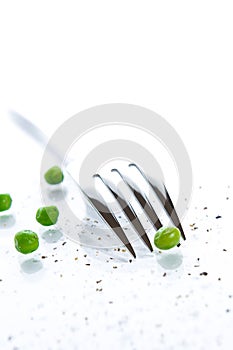 Close-up of fork and peas