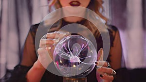 Close up of fortune teller performing ritual and crystal ball foreseeing future
