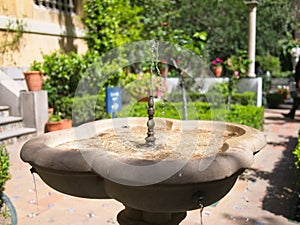 Close-up of a fountain at the courtyard of the Sorolla Museum. photo