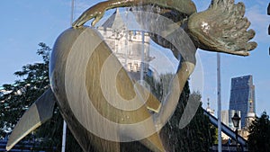 Close up of the fountain of girl with dolphin near Tower Bridge