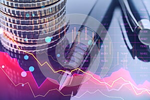 Close up of fountain pen and stacked coins on desk with pink crisis business and forex chart on blurry background with bokeh