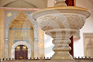 Close-up on the fountain Sadrvan located in the courtyard of Gazi Husrev Begova Mosque photo