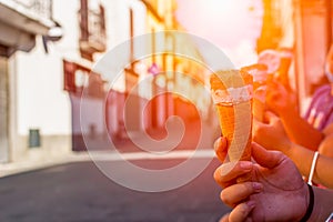 Close Up of four Girls holding four Icecreams in the street