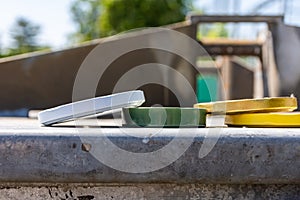 Close-up of four various lids thrown outside