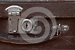 Close-up fragment of lock on the vintage suitcase