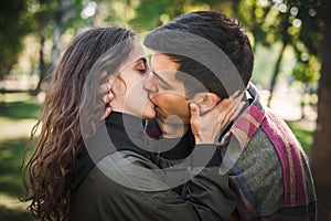 Close-up of French kiss. Couple in love hugging and kissing