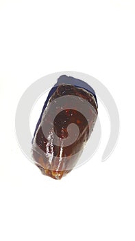 Close-up of fresh, appetizing dates. Isolated on a white background.