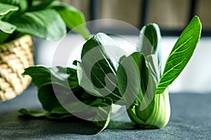 close up Fresh baby green bok choy on the black background , overhead or top view shot