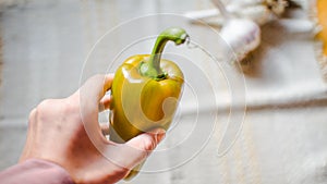 Close up on fresh bell green peppers in hand