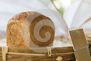 Close up fresh bread homemade in wicker basket.