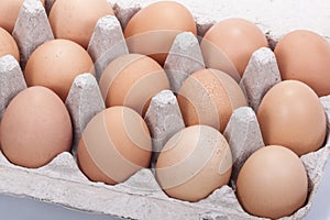 Close up of Fresh Brown Eggs in a Cardboard Tray