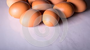 Close-up of fresh brown eggs ,side view,copy space,background